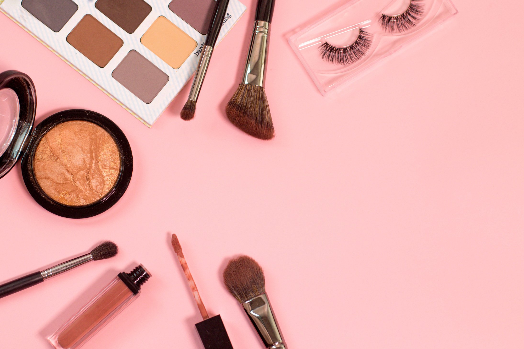 Cosmetic Products on Pink Background Flatlay